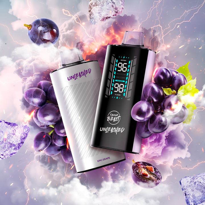 Two Flavour Beast Unleashed vapes in white and black, surrounded by grapes with a vibrant, purple-hued background.